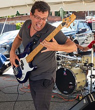 Run the Ride performs the noon set on the Melon Stage at the 43rd Annual Carytown Watermelon Festival in Carytown on Sunday Aug 10. The event filled Cary Street with more than 100 vendors and artisans selling everything from crafts and teas to food, cups of fresh watermelon, and watermelon-flavored treats and drinks. The event featured live music across five stages, with additional small entertainment acts scattered throughout the street. Activities for all ages included face painting, a children’s area, and carnival rides.