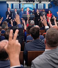 President Donald Trump, center, points to members of the media as he speaks with reporters in the James Brady Press Briefing Room at the White House on August 11 in Washington, DC.
Mandatory Credit:	Alex Brandon/AP via CNN Newsource