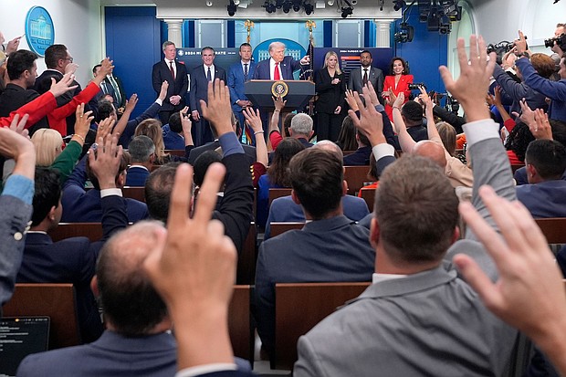 President Donald Trump, center, points to members of the media as he speaks with reporters in the James Brady Press Briefing Room at the White House on August 11 in Washington, DC.
Mandatory Credit:	Alex Brandon/AP via CNN Newsource