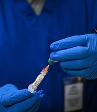 Caption:	A health worker prepares a dose of the measles vaccine at a health center in Lubbock, Texas, on February 27. The measles outbreak centered in West Texas – one of the largest and deadliest in centuries – has ended, state health officials announced on August 18.
Mandatory Credit:	Ronaldo Schemidt/AFP/Getty Images via CNN Newsource