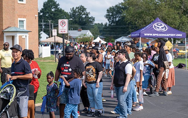 Students and their families gather at Speaking Spirit Ministries in Richmond on Saturday, Aug. 16, for Urban One Inc.’s Prep for Success Back to School Bash, receiving free supplies and community resources.