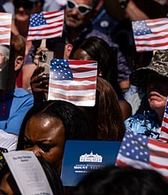 New US citizens use handheld fans to take shade from the sun during a naturalization ceremony at George Washington's Mount Vernon in Virginia, on July 4.
Mandatory Credit:	Kent Nishimura/Bloomberg/Getty Images/File via CNN Newsource