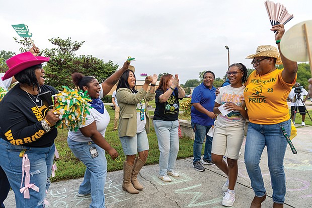 Deionna, a sixth grader at Henderson Middle School, is greeted Monday, Aug. 18, by cheering faculty, staff and Richmond Public Schools representatives on his first day of middle school. Students were also greeted with remarks from Superintendent Jason Kamras, school Principal Allen Vernon and others. RPS launched a staggered start to the 2025-26 school year to help students transition to middle and high school. Students in preschool, kindergarten, grades 1-5, sixth grade and ninth grade began Monday, while grades 7-8 and 10-12 started Tuesday, Aug. 19.