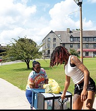 Wanda Williams helps daughter Deonna Glass move into Newman Hall on the campus of Virginia Union University, Saturday, Aug. 16.