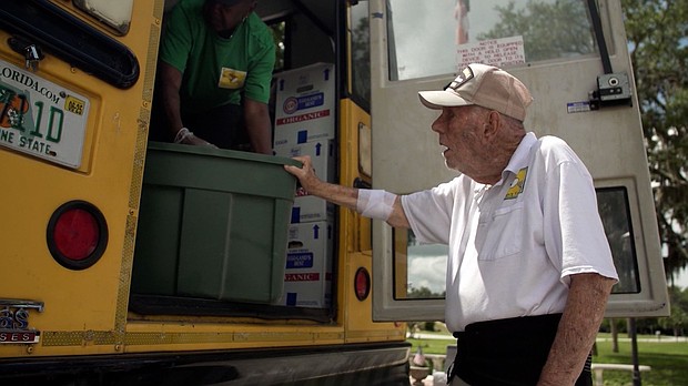 Bill Brown helps with a food delivery along the Children's Table weekly bus route.
Mandatory Credit:	CNN via CNN Newsource