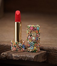 A Dior lipstick encrusted with colorful jewels.
Mandatory Credit:	Piotr Stoklosa via CNN Newsource