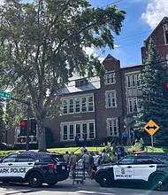 Police and first responders work at the scene of the shooting at Annunciation Church and Catholic School in Minneapolis on August 27.
Mandatory Credit:	Eva Claire Hambach/AFP via Getty Images via CNN Newsource