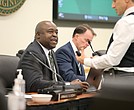 Gregory Washington, president of George Mason University, speaks with a guest during a Aug. 1 Board of Visitors meeting.