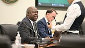 Gregory Washington, president of George Mason University, speaks with a guest during a Aug. 1 Board of Visitors meeting.