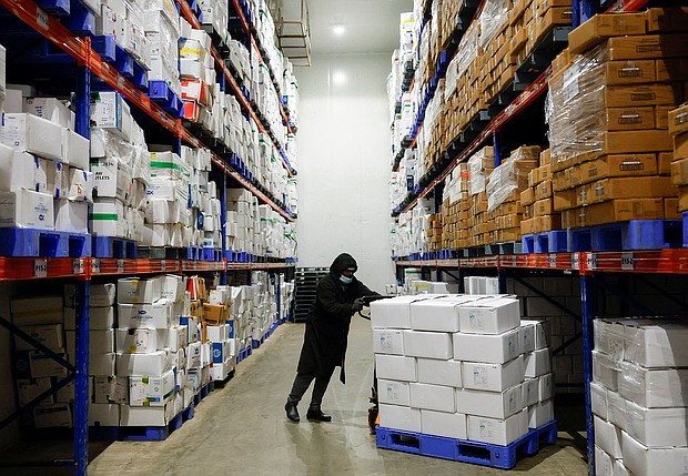 A worker pushes a cart of packaged frozen shrimp at a factory on the outskirts of Vishakhapatnam, India.
Mandatory Credit:	Sahiba Chawdhary/Reuters via CNN Newsource