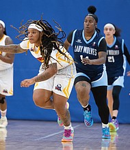 Moe Kinard (#20) of the Richmond Roadrunners pushes the pace down the court against the Maryland Lady Wolves on Saturday, Aug. 23, at the Henrico Sports & Events Center. Despite Kinard’s effort, Richmond fell 56-71.
