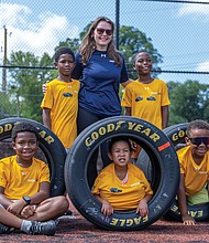 Standing from left: Ahki, 8; Bryn Shane, program coordinator at the
Cal Ripken Sr. Foundation; and Josiah, 9, Sitting: Wallace, 8; Neiko, 4;
and Carter, 8 take a photo together at soccer clinic hosted by the Cal Ripken Sr. Foundation with sponsor Gainbridge, where participants rotated through skill stations for passing, dribbling, shooting and scrimmaging. The Gainbridge Super League, a Division I professional women’s soccer league, was the primary sponsor of Justin Haley’s No. 7 Chevrolet ZL1 for Richmond Raceway’s Saturday night NASCAR Cup Series race on Aug. 16. Haley and the league also donated a set of signed race tires to the Boys & Girls Clubs of Metro Richmond the Cal Ripken Sr. Foundation.