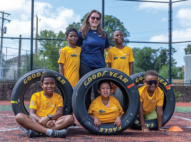 Standing from left: Ahki, 8; Bryn Shane, program coordinator at the
Cal Ripken Sr. Foundation; and Josiah, 9, Sitting: Wallace, 8; Neiko, 4;
and Carter, 8 take a photo together at soccer clinic hosted by the Cal Ripken Sr. Foundation with sponsor Gainbridge, where participants rotated through skill stations for passing, dribbling, shooting and scrimmaging. The Gainbridge Super League, a Division I professional women’s soccer league, was the primary sponsor of Justin Haley’s No. 7 Chevrolet ZL1 for Richmond Raceway’s Saturday night NASCAR Cup Series race on Aug. 16. Haley and the league also donated a set of signed race tires to the Boys & Girls Clubs of Metro Richmond the Cal Ripken Sr. Foundation.
