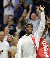 Venus Williams, of the United States, waves to fans after being defeated by Karolina Muchova, of the Czech Republic, during the first round of the U.S. Open tennis championships, Monday, Aug. 25, 2025, in New York.