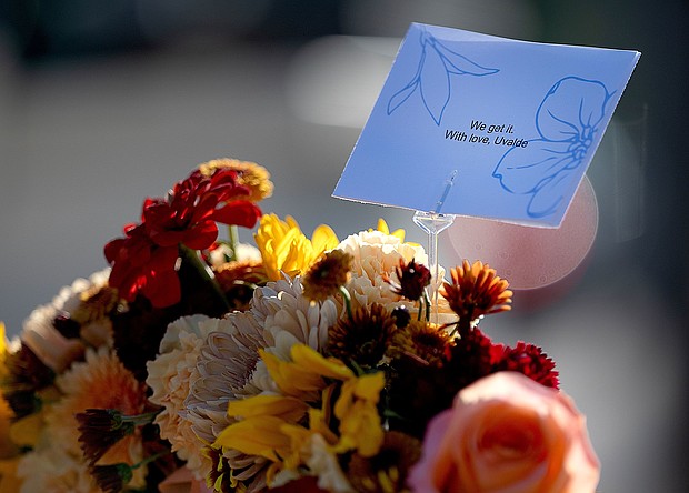 A sympathy note from Uvalde, Texas, where a 2022 school shooting took place, sits in a memorial near Annunciation Catholic Church in Minneapolis on August 28.
Mandatory Credit:	Elizabeth Flores/The Star Tribune/Getty Images via CNN Newsource