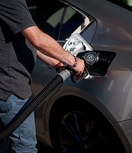 Gas prices are averaging less than $3 a gallon in more than a dozen US states, according to AAA.
Mandatory Credit:	Eric Thayer/Bloomberg/Getty Images via CNN Newsource