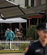 Crime laboratory officers search the home of Gilgo Beach killings suspect Rex Heuermann in Massapequa Park, New York, on July 18, 2023.
Mandatory Credit:	Yuki Iwamura/AFP/Getty Images via CNN Newsource