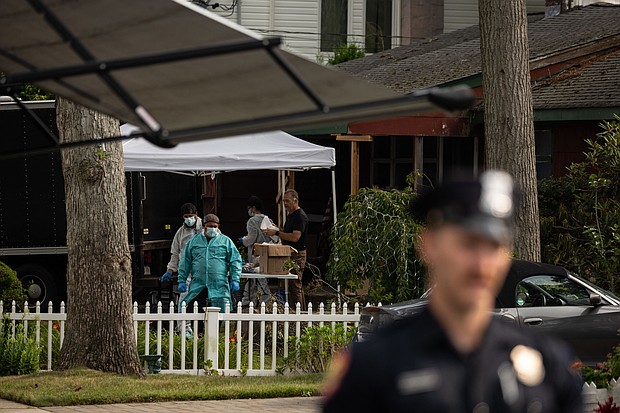 Crime laboratory officers search the home of Gilgo Beach killings suspect Rex Heuermann in Massapequa Park, New York, on July 18, 2023.
Mandatory Credit:	Yuki Iwamura/AFP/Getty Images via CNN Newsource