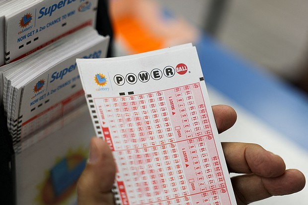 A customer holds a number slip for Powerball lottery tickets inside the Bluebird Liquor Store in Hawthorne, California, on August 25.
Mandatory Credit:	Patrick T. Fallon/AFP/Getty Images via CNN Newsource