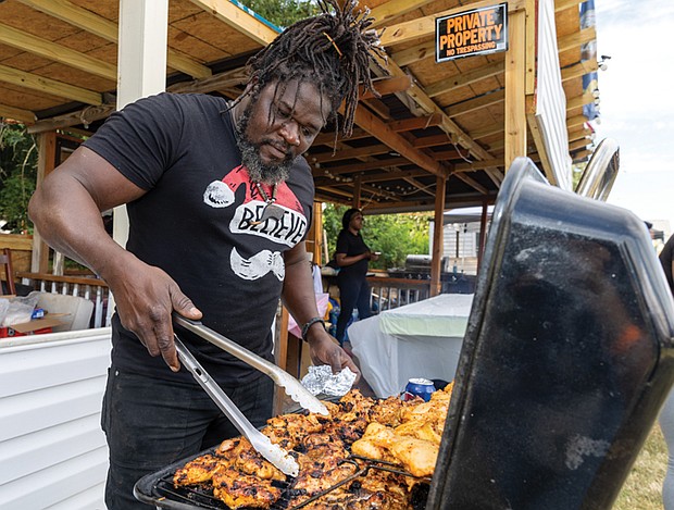 Richard McIntosh of L.I.B. True Taste cooks Liberian grilled chicken and jollof rice.