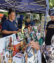 Double the sales pitch with twin sisters Kathy Anderson and Karen
Bowling selling books at the festival.