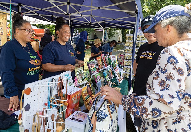 Double the sales pitch with twin sisters Kathy Anderson and Karen
Bowling selling books at the festival.