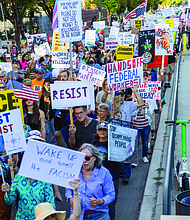 Demonstrators head west on Broad Street during the “Workers Over Billionaires” Labor Day March in Richmond on Monday, Sept. 1. After remarks from local activists and community members at Monroe Park, the march, co-sponsored by RVA Indivisible and the 50501 Movement, proceeded to Lombardy Street, then Franklin Street, and returned to Monroe Park.