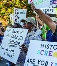Gale Mumford marched west down Broad St with hundreds of other demonstrators during the “Workers Over Billionaires” Labor Day March in Richmond on Monday, Sept. 1, 2025. After remarks by local activists and community members in Monroe Park, the march, co-sponsored by RVA Indivisible and 50501, headed toward Broad Street, up to Lombardy, over to Franklin and back to Monroe Park. (Julianne Tripp Hillian / Richmond Free Press)(Julianne Tripp Hillian / Richmond Free Press)