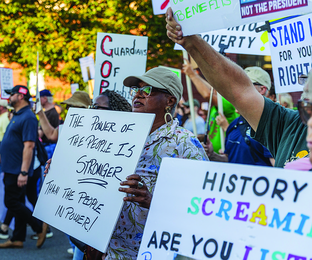 Gale Mumford marched west down Broad St with hundreds of other demonstrators during the “Workers Over Billionaires” Labor Day March in Richmond on Monday, Sept. 1, 2025. After remarks by local activists and community members in Monroe Park, the march, co-sponsored by RVA Indivisible and 50501, headed toward Broad Street, up to Lombardy, over to Franklin and back to Monroe Park. (Julianne Tripp Hillian / Richmond Free Press)(Julianne Tripp Hillian / Richmond Free Press)