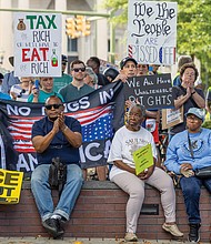 Demonstrators gather at Monroe Park in Richmond on Monday for the “Workers Over Billionaires” Labor Day march.