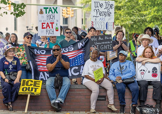 Demonstrators gather at Monroe Park in Richmond on Monday for the “Workers Over Billionaires” Labor Day march.
