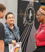 Attendees speak with representatives from local employers at Henrico’s Life- Ready Expo in 2024.