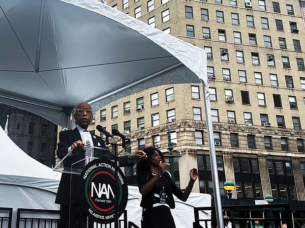 Protesters march on Wall Street in New York on Aug. 28 to denounce companies abandoning diversity, equity and inclusion initiatives. Left, The Rev. Al Sharpton addresses protesters during the March on Wall Street in New York urging action against economic inequality.