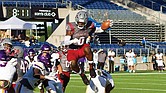 Virginia Union running back Curtis Allen (0) leaps over defenders during the Panthers’ 45-3 win over Miles College in the Black College Football Hall of Fame Classic on Sunday at Tom Benson Hall of Fame Stadium in Canton, OH.