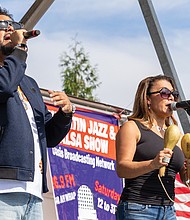 Carlos Xavier (L) and Vivian Mojica perform with La Mafia del Guaguanco.