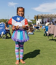 Ella, 6, of Richmond, enjoys the 18th Annual Jazz and Salsa Festival at Midtown Green on Saturday, Aug. 30. Please see more photos from the event on B2.
