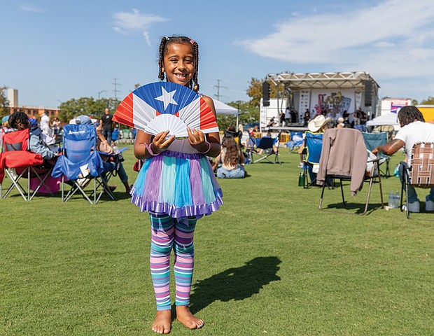 Ella, 6, of Richmond, enjoys the 18th Annual Jazz and Salsa Festival at Midtown Green on Saturday, Aug. 30. Please see more photos from the event on B2.