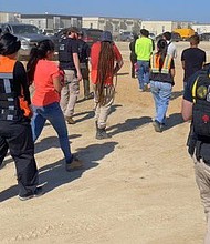 Law enforcement conduct a major immigration operation at the construction site of a Hyundai battery plant in Georgia Thursday, as seen in this image released by the ATF's Atlanta office.
Mandatory Credit:	ATF Atlanta/X via CNN Newsource
