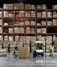 Workers apply labels to boxes of goods in Hagerstown, Maryland, on May 21, 2024.
Mandatory Credit:	Samuel Corum/Bloomberg/Getty Images via CNN Newsource