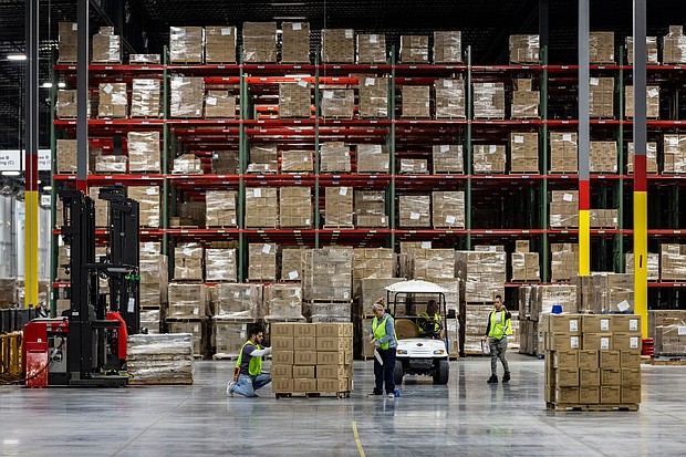Workers apply labels to boxes of goods in Hagerstown, Maryland, on May 21, 2024.
Mandatory Credit:	Samuel Corum/Bloomberg/Getty Images via CNN Newsource