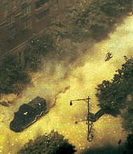 A New York Police Department vehicle and a motorcyclist speed down a street toward the World Trade Center after the North Tower's collapse on September 11, 2001. The photo was recently found on a forgotten floppy disk.
Mandatory Credit:	courtesy Dennis Lovelady via CNN Newsource