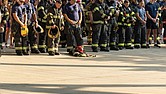 Firefighters, first responders and community members bow their heads in a moment of silence during the opening ceremony Saturday, Sept. 6 at
Richmond Raceway after completing the Metro Richmond 9/11 Memorial Stair Climb. The event honors first responders who died on Sept. 11, 2001,
and those who later died from related health complications. Participants climbed 2,200 steps, representing the 110 stories of the World Trade Center,or walked a 5K around the track. For more photos, see A3.