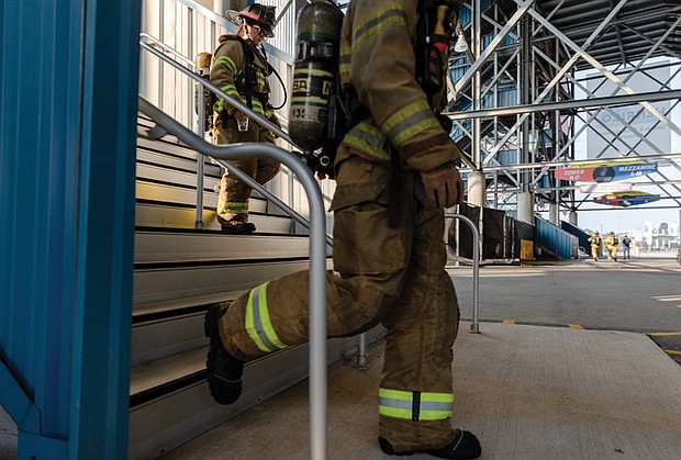 Local firefighters climb 2,200 steps at Richmond Raceway. The event honors first responders who died in the 2001 attacks and those lost to related illnesses.