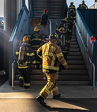 Firefighters climb stairs during the Metro Richmond 9/11 Memorial Stair Climb at Richmond Raceway on Saturday,Sept. 6.