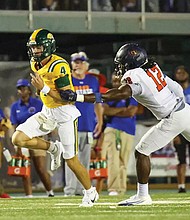 Norfolk State’s quarterback Otto Kuhns (#4) sprints downfield as Virginia State’s Mehkhi Johnson (#12) gives chase during Saturday’s 34-31 overtime win at William “Dick” Price Stadium.