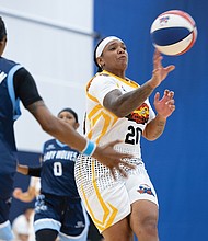 Moe Kinard (#20) of Richmond’s women’s professional basketball team, the Richmond Roadrunners, passes the ball in a game against the MD Lady Wolves on Saturday, Aug. 23, at the Henrico Sports & Events Center. Final score: Richmond 56, MD Lady Wolves 71.