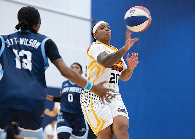 Moe Kinard (#20) of Richmond’s women’s professional basketball team, the Richmond Roadrunners, passes the ball in a game against the MD Lady Wolves on Saturday, Aug. 23, at the Henrico Sports & Events Center. Final score: Richmond 56, MD Lady Wolves 71.