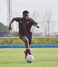 Terry Richard, 14, of Chesterfield, controls the ball during a youth soccer game. Richard is heading to Spain to train with Patacona CF in Valencia.