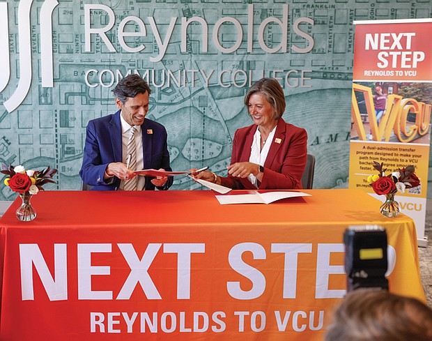 Virginia Commonwealth University President Michael Rao and Reynolds Community College President Paula Pando sign documents Tuesday, Sept. 8 to launch NEXT Step VCU, a dual-admission program that helps eligible community college students transfer to VCU. The first group will include about 50 to 100 students, with plans to grow in future years.