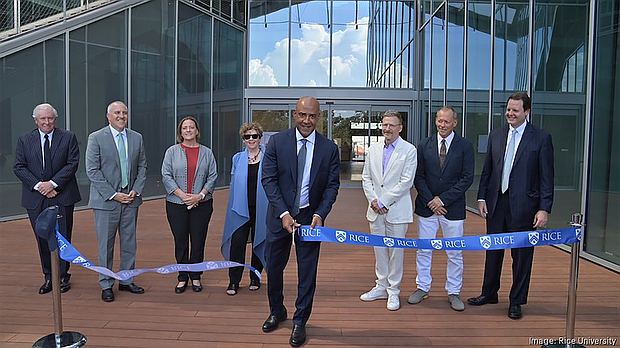 Rice University President Reginald DesRoches cuts a ribbon during the grand opening celebration for the new Sarofim Hall, which will house the university's arts department.